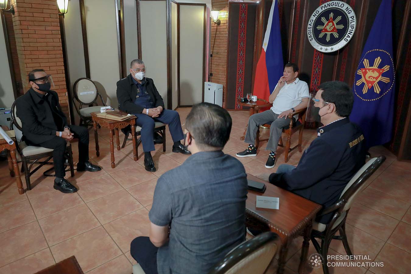 President Rodrigo Roa Duterte meets with Philippine National Police Chief Debold Menorias Sinas and Philippine Drug Enforcement Agency (PDEA) Director General Wilkins Villanueva as he orders both of them to discontinue their ongoing investigation after directing an order to the National Bureau of Investigation (NBI) to conduct a probe on the recent shootout in Commonwealth Avenue, Quezon City. The President aims to ensure impartiality on the said incident. With them during the meeting at the Malacañang Golf (Malago) Clubhouse in Malacañang Park, Manila on February 26, 2021 are Senator Christopher Lawrence Go, Justice Secretary Menardo Guevarra, Presidential Spokesperson Herminio Harry Roque Jr., and NBI Director Antonio Pagatpat. ACE MORANDANTE/ PRESIDENTIAL PHOTO