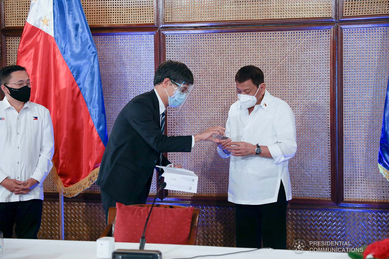 President Rodrigo Roa Duterte receives his government-issued identification card from National Economic and Development Authority Acting Secretary Karl Kendrick Chua at the Malacañan Palace on March 3, 2021. The Philippine Identification System ID or the Philippine Identification Card is the official national identity card for Filipino citizens worldwide and foreign permanent residents in the Philippines. KARL NORMAN ALONZO/ PRESIDENTIAL PHOTO