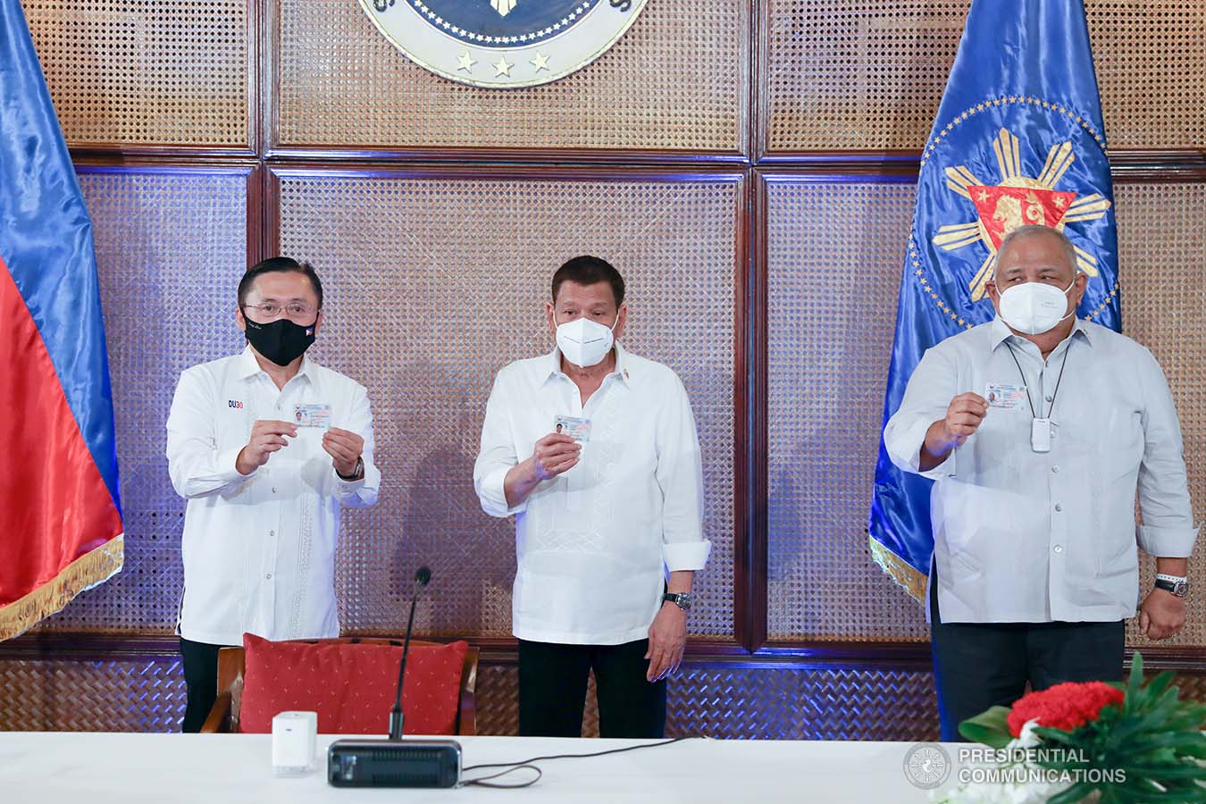 President Rodrigo Roa Duterte together with Senator Christopher Lawrence Go and Executive Salvador Medialdea show their government-issued identification cards at the Malacañan Palace on March 3, 2021. KARL NORMAN ALONZO/ PRESIDENTIAL PHOTO