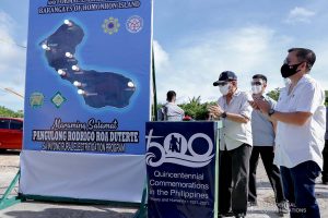 President Rodrigo Roa Duterte leads the ceremonial switch-on for the electricity of Homonhon Island in Eastern Samar on March 18, 2021. Accompanying the President is Senator Christopher Lawrence Go. REY BANIQUET/ PRESIDENTIAL PHOTO