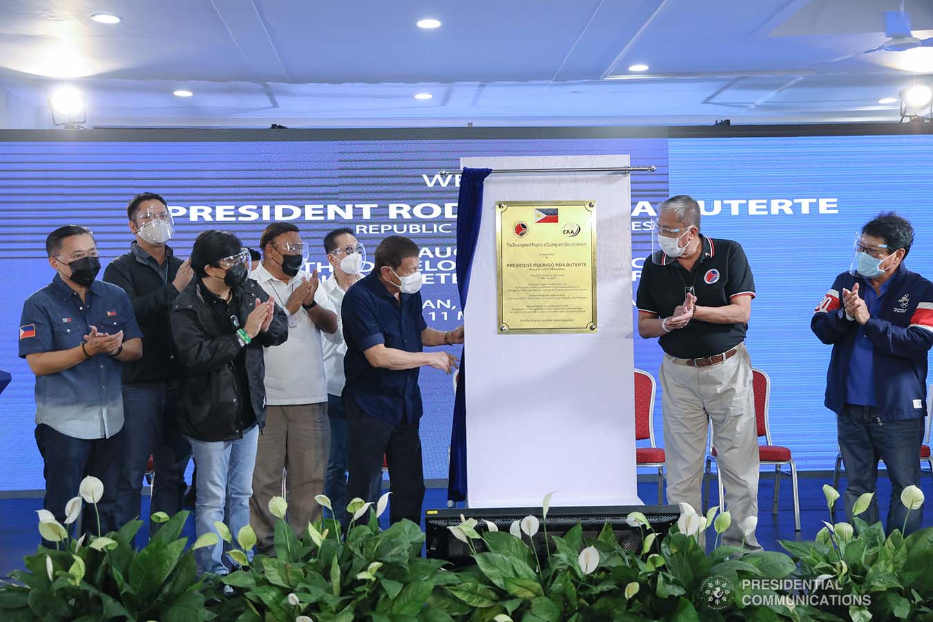 President Rodrigo Roa Duterte leads the unveiling of the marker of the development projects at Dumaguete (Sibulan) Airport in Sibulan, Negros Oriental on March 11, 2021. The President was assisted by Senator Christopher Lawrence “Bong” Go, Transportation Secretary Arthur Tugade, Presidential Assistant for the Visayas Secretary Michael Lloyd Dino, and Civil Aviation Authority of the Philippines Director General Jim Sydiongco. Also present are Presidential Communications and Operations Office Secretary Martin Andanar, Presidential Spokesperson Herminio "Harry" Roque Jr., Chief Presidential Legal Counsel Salvador "Sal" Panelo, Labor and Employment Secretary Silvestre Bello III, and Negros Oriental Governor Roel Degamo. VALERIE ESCALERA/ PRESIDENTIAL PHOTO