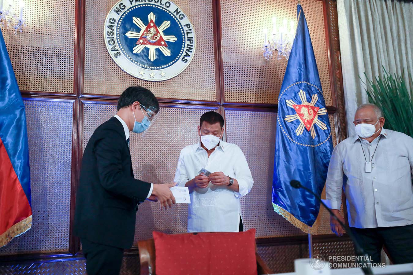 President Rodrigo Roa Duterte receives his government-issued identification card from National Economic and Development Authority Acting Secretary Karl Kendrick Chua at the Malacañan Palace on March 3, 2021. The Philippine Identification System ID or the Philippine Identification Card is the official national identity card for Filipino citizens worldwide and foreign permanent residents in the Philippines. ACE MORANDANTE/ PRESIDENTIAL PHOTO