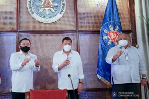 President Rodrigo Roa Duterte together with Senator Christopher Lawrence Go and Executive Salvador Medialdea show their government-issued identification cards at the Malacañan Palace on March 3, 2021. ACE MORANDANTE/ PRESIDENTIAL PHOTO