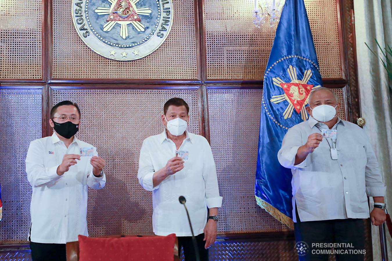 President Rodrigo Roa Duterte together with Senator Christopher Lawrence Go and Executive Salvador Medialdea show their government-issued identification cards at the Malacañan Palace on March 3, 2021. ACE MORANDANTE/ PRESIDENTIAL PHOTO