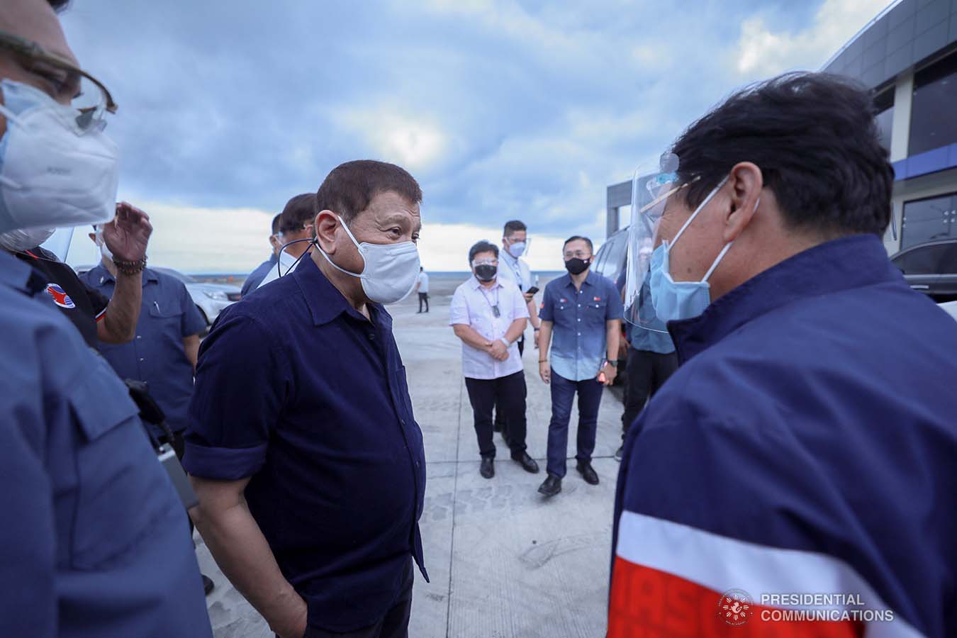 President Rodrigo Roa Duterte discusses matters with Labor and Employment Secretary Silvestre Bello III after leading the inauguration of the Port Operations Building at the Port of Dumaguete in Dumaguete City, Negros Oriental on March 11, 2021. ACE MORANDANTE/ PRESIDENTIAL PHOTO