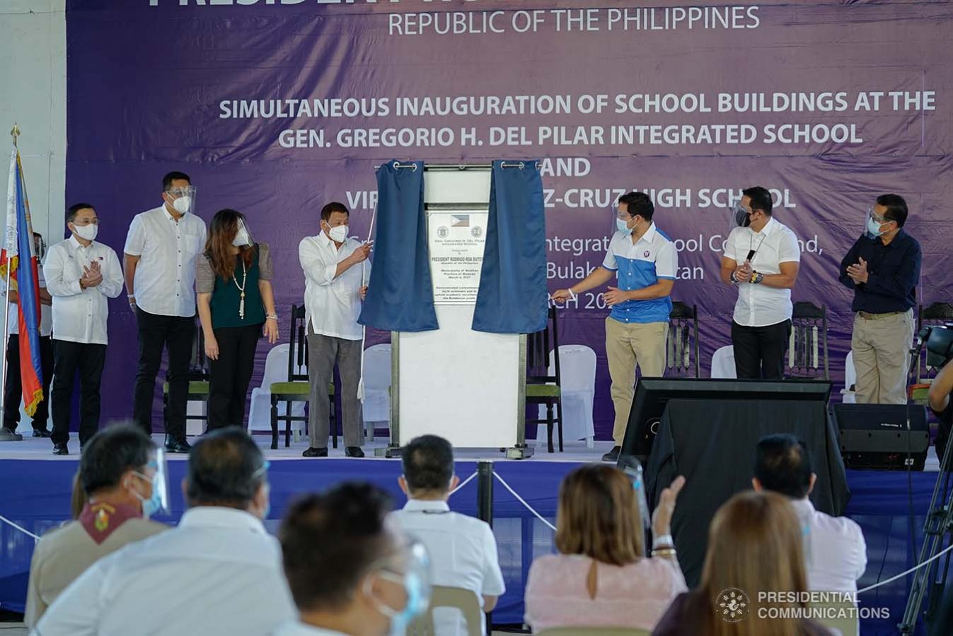 President Rodrigo Roa Duterte, assisted by DWPH Secretary Mark Villar and Bulacan Governor Daniel Fernando, leads the unveiling of marker of the newly constructed Gen. Gregorio H. Del Pilar Integrated School and Virginia Ramirez-Cruz High School buildings in Bulakan, Bulacan on March 4, 2021. Also present were Senator Christopher Lawrence Go, President Duterte's partner Honeylet Avanceña, and local officials of Bulacan province. KING RODRIGUEZ/ PRESIDENTIAL PHOTO