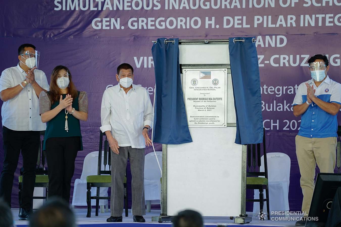 President Rodrigo Roa Duterte, assisted by DWPH Secretary Mark Villar and Bulacan Governor Daniel Fernando, leads the unveiling of marker of the newly constructed Gen. Gregorio H. Del Pilar Integrated School and Virginia Ramirez-Cruz High School buildings in Bulakan, Bulacan on March 4, 2021. Also present were Senator Christopher Lawrence Go, President Duterte's partner Honeylet Avanceña, and local officials of Bulacan province. KING RODRIGUEZ/ PRESIDENTIAL PHOTO