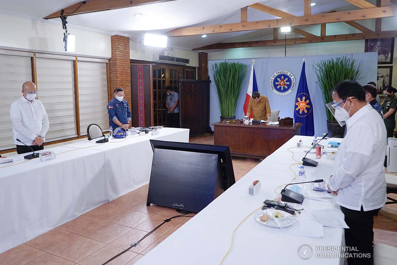 President Rodrigo Roa Duterte together with his Cabinet members bow their heads in prayer for the departed soul of Presidential Legislative Liaison Secretary Adelino Sitoy who succumbed to Covid-19 during the meeting with the Inter-Agency Task Force on the Emerging Infectious Diseases (IATF-EID) core members at the Malacañang Golf (Malago) Clubhouse in Malacañang Park, Manila on April 15, 2021. KING RODRIGUEZ/ PRESIDENTIAL PHOTO