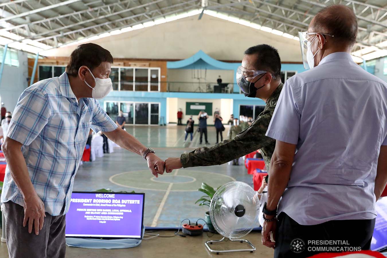 President Rodrigo Roa Duterte fist bumps with Armed Forces of the Philippines Chief of Staff General Cirilito Sobejana during the meeting with Bangsamoro Autonomous Region in Muslim Mindanao (BARMM), local government officials, and area commanders of the Armed Forces of the Philippines and the Philippine National Police  at Camp BGen. Gonzalo H. Siongco in Datu Odin Sinsuat, Maguindanao on May 11, 2021. TOTO LOZANO/ PRESIDENTIAL PHOTO