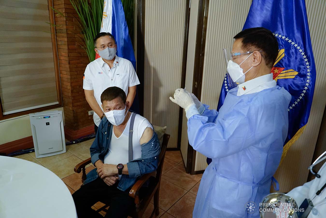 President Rodrigo Roa Duterte receives a shot of Covid-19 vaccine administered by Health Secretary Francisco Duque III at the Malacañang Golf (Malago) Clubhouse in Malacañang Park, Manila on May 3, 2021. KING RODRIGUEZ/ PRESIDENTIAL PHOTO