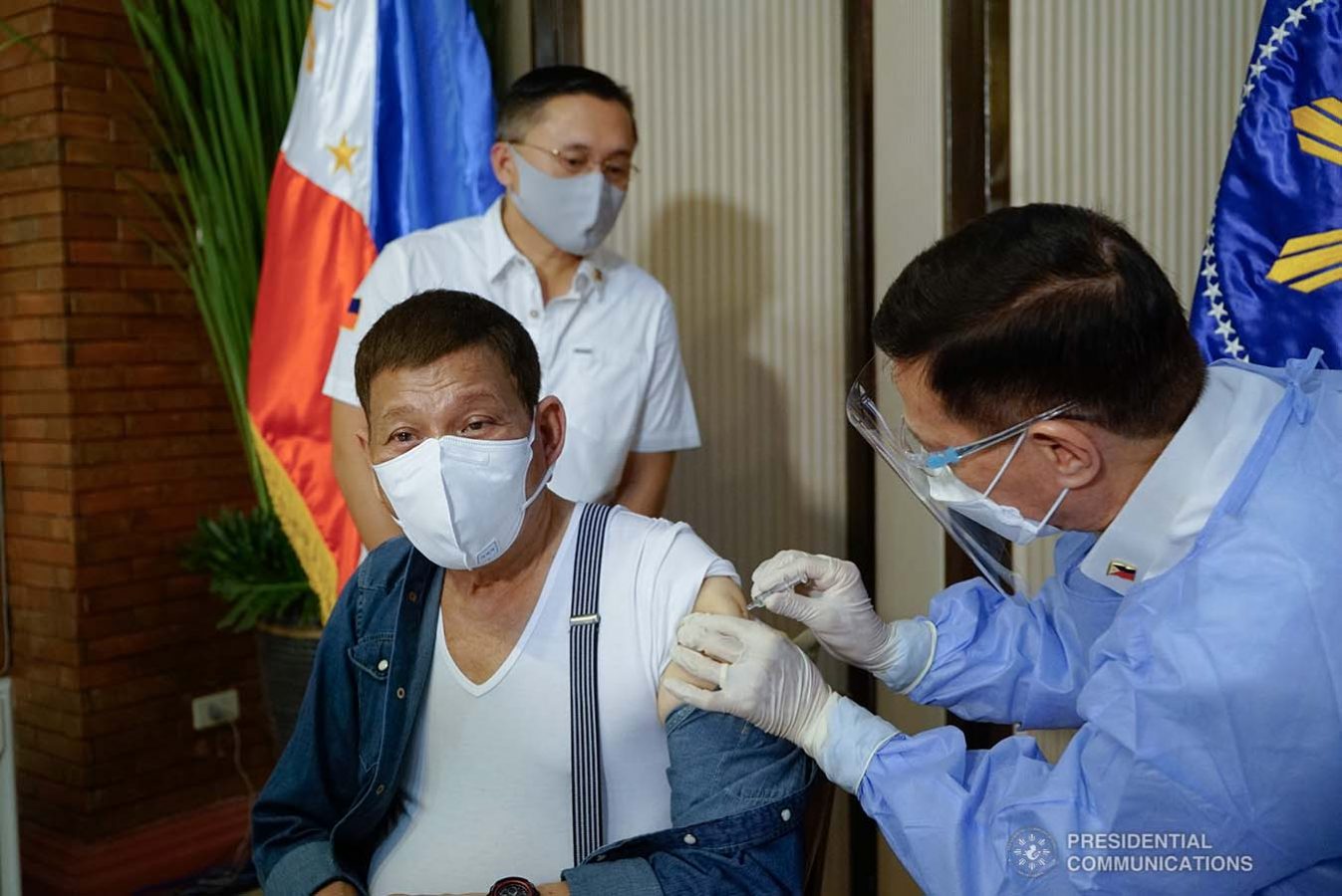 President Rodrigo Roa Duterte receives a shot of Covid-19 vaccine administered by Health Secretary Francisco Duque III at the Malacañang Golf (Malago) Clubhouse in Malacañang Park, Manila on May 3, 2021. KING RODRIGUEZ/ PRESIDENTIAL PHOTO