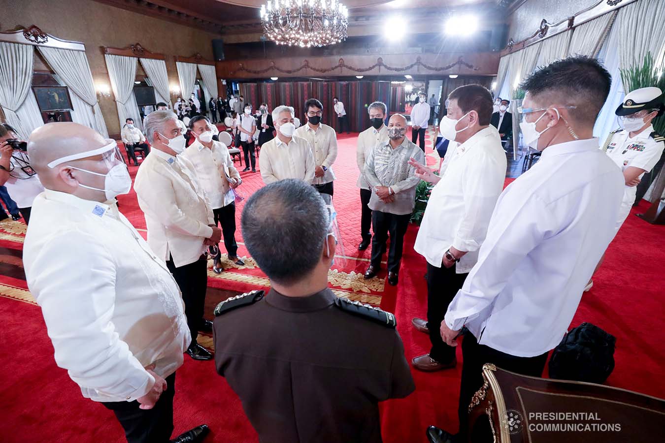 President Rodrigo Roa Duterte discusses matters with  legislators and officials from various agencies on the sidelines following the ceremonial re-enactment of the signing of bills at the Malacañang Palace on June 16, 2021. TOTO LOZANO/ PRESIDENTIAL PHOTO