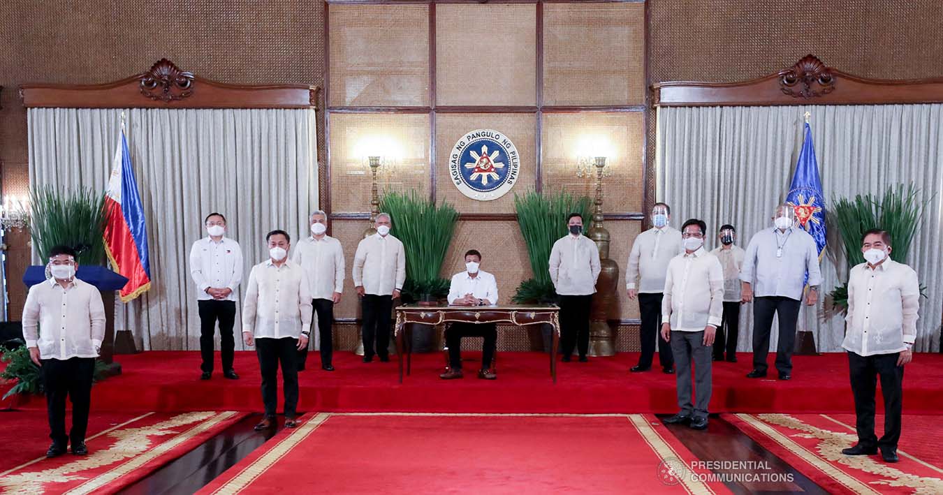 President Rodrigo Roa Duterte leads the re-enactment of the signing of the Republic Act No. 11545, or An Act Reapportioning the First Legislative District of the City of Caloocan Into Two (2) Legislative Districts (Signed on May 23, 2021) during the ceremony at the Malacañang Palace on June 16, 2021. Witnessing the ceremonial signing are (left to right) Rep. Dale Malapitan, Sen. Christopher Lawrence Go, Sen. Francis Tolentino, Senate Majority Floor Leader Juan Miguel Zubiri, Senate President Vicente Sotto III, House Speaker Rep. Lord Allan Jay Velasco, House Majority Floor Leader Ferdinand Martin Romualdez, Rep. Noel Villanueva, Executive Secretary Salvador Medialdea, and Caloocan Mayor Oscar Malapitan. TOTO LOZANO/ PRESIDENTIAL PHOTO