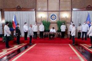 President Rodrigo Roa Duterte leads the re-enactment of the signing of the Republic Act (RA) No. 11549, or An Act Lowering the Minimum Height Requirement for Applicants of the Philippine National Police (PNP), Bureau of Fire Protection (BFP), Bureau of Jail Management and Penology (BJMP), and Bureau of Corrections (BuCor), Amending RA no. 6975, As Amended, RA no. 9263, and RA No. 10575 (Signed on May 26, 2021) during the ceremony at the Malacañang Palace on June 16, 2021. Witnessing the ceremonial signing are (left to right) BFP Director Jose Embang Jr., PNP Chief Plt.Gen. Guillermo Eleazar, BJMP Director Allan Iral, Sen. Bong Revilla, Sen. Christopher Lawrence Go, Senate Majority Floor Leader Juan Miguel Zubiri, Senate President Vicente Sotto III, House Speaker Rep. Lord Allan Jay Velasco, House Majority Floor Leader Ferdinand Martin Romualdez, Rep. Narciso Bravo, Executive Secretary Salvador Medialdea, Rep. Jorge Bustos, BuCor Director General Gerald Bantag, and Justice Secretary Menardo Guevarra. TOTO LOZANO/ PRESIDENTIAL PHOTO