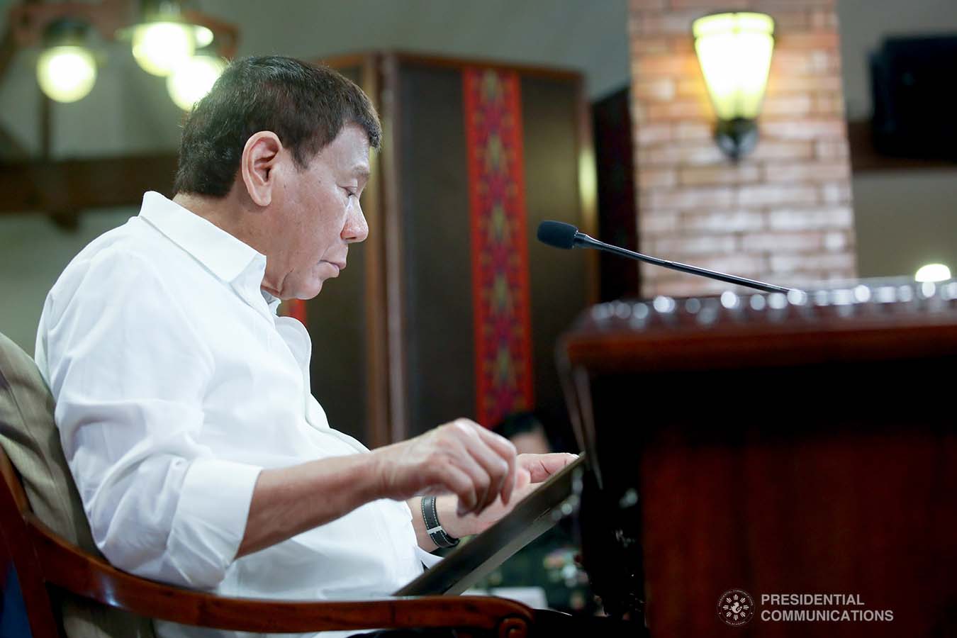 President Rodrigo Roa Duterte skims through a document as he presides over a meeting with the Inter-Agency Task Force on the Emerging Infectious Diseases (IATF-EID) core members prior to his talk to the people at the Malacañang Golf (Malago) Clubhouse in Malacañang Park, Manila on May 31, 2021. ROBINSON NIÑAL/ PRESIDENTIAL PHOTO