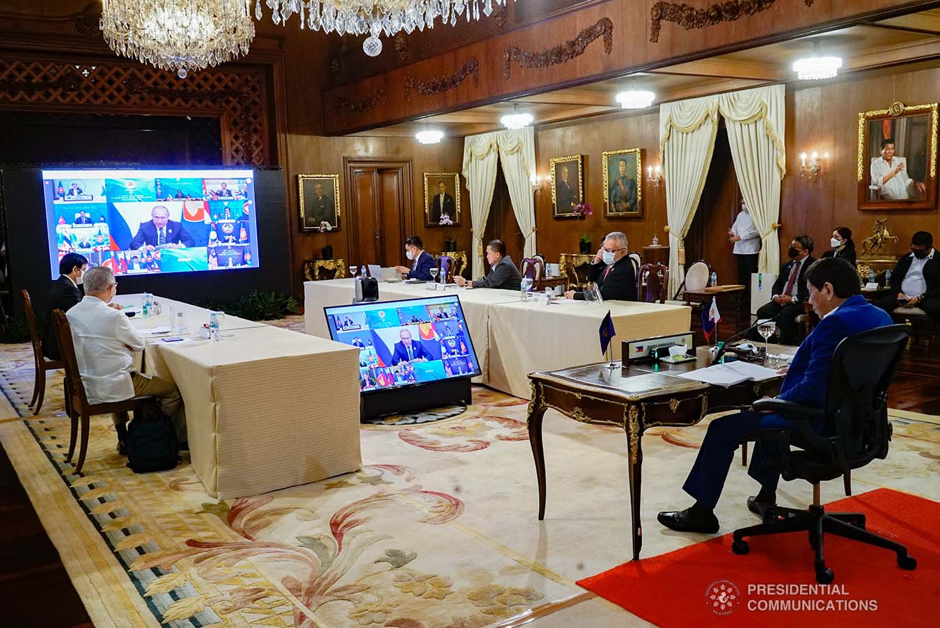 President Rodrigo Roa Duterte together with other leaders from Association of Southeast Asian Nations (ASEAN) member countries are shown on-screen with Russian President Vladimir Putin as the plenary meeting with the Russian Federation is live-streamed by this year's host country, Brunei Darussalam, at the Malacañang Palace on October 28, 2021. KING RODRIGUEZ/ PRESIDENTIAL PHOTO