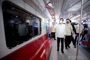 President Rodrigo Roa Duterte inspects one of the brand-new trains for the Metro Rail Transit Line 7 (MRT-7) after leading the unveiling ceremony at the MRT-7 tracks along Commonwealth Avenue in Diliman, Quezon City on December 16, 2021. ALBERTO ALCAIN/ PRESIDENTIAL PHOTO