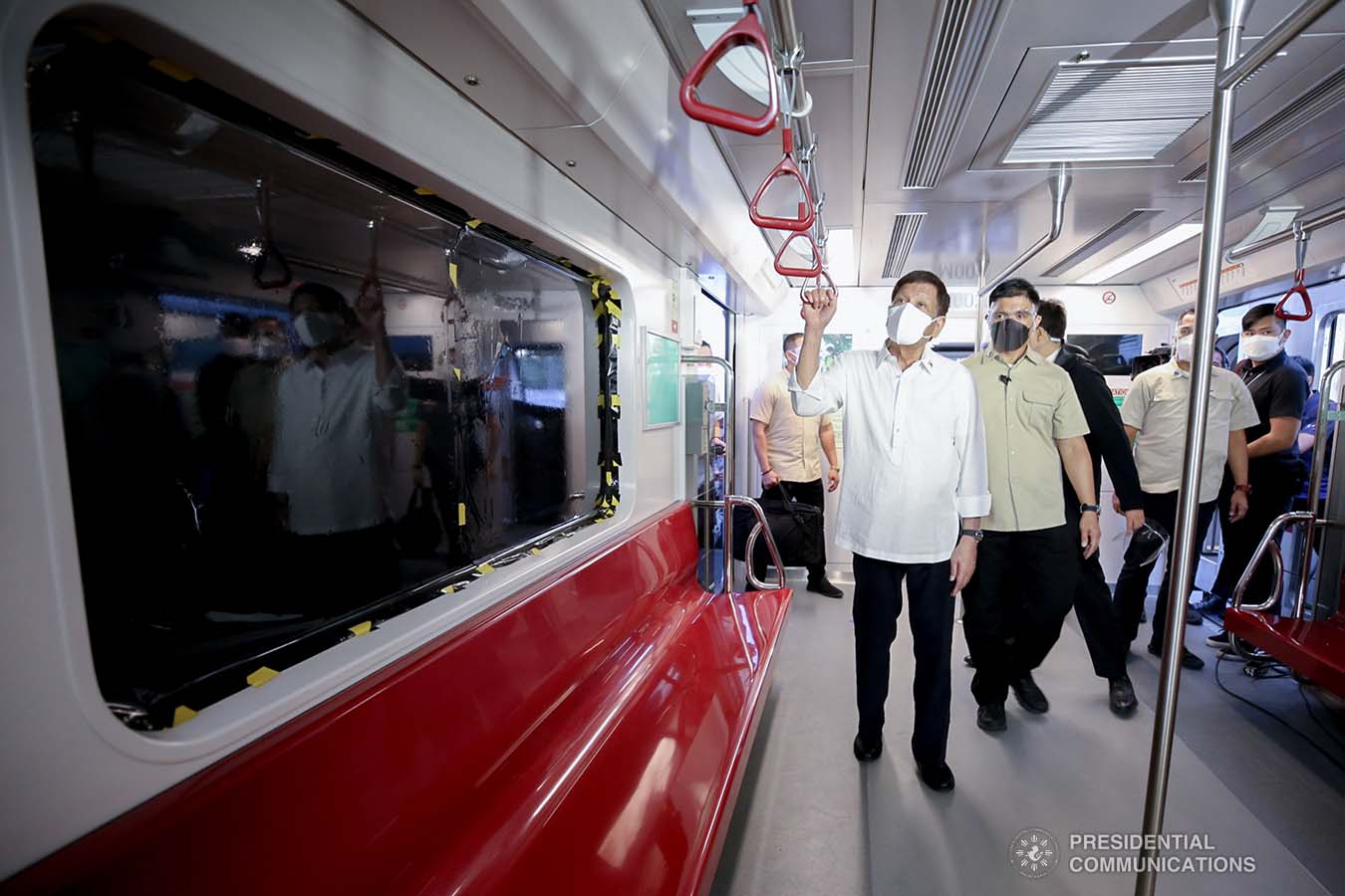 President Rodrigo Roa Duterte inspects one of the brand-new trains for the Metro Rail Transit Line 7 (MRT-7) after leading the unveiling ceremony at the MRT-7 tracks along Commonwealth Avenue in Diliman, Quezon City on December 16, 2021. ALBERTO ALCAIN/ PRESIDENTIAL PHOTO