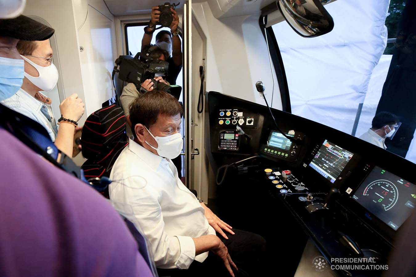 President Rodrigo Roa sits on the cockpit of a Metro Rail Transit 7 (MRT-7) train while inspecting it following the unveiling ceremony at the MRT-7 tracks along Commonwealth Avenue in Diliman, Quezon City on December 16, 2021. ALBERTO ALCAIN/ PRESIDENTIAL PHOTO