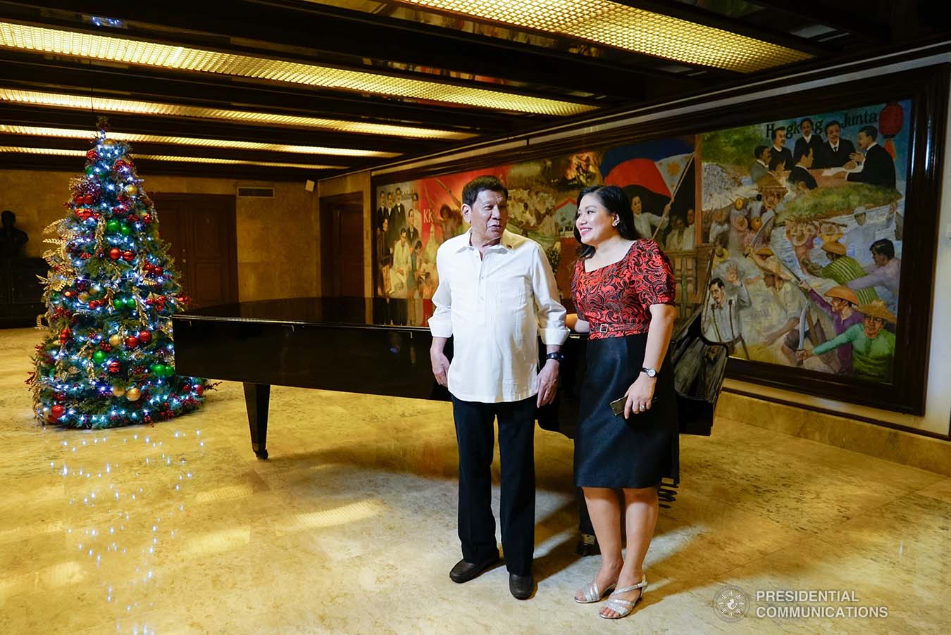 President Rodrigo Roa Duterte and his partner Honeylet Avanceña interact while preparing to attend the Christmas tree lighting ceremony of the Office of the President at the Kalayaan Grounds in Malacañan Palace on December 1, 2021. KING RODRIGUEZ/ PRESIDENTIAL PHOTO