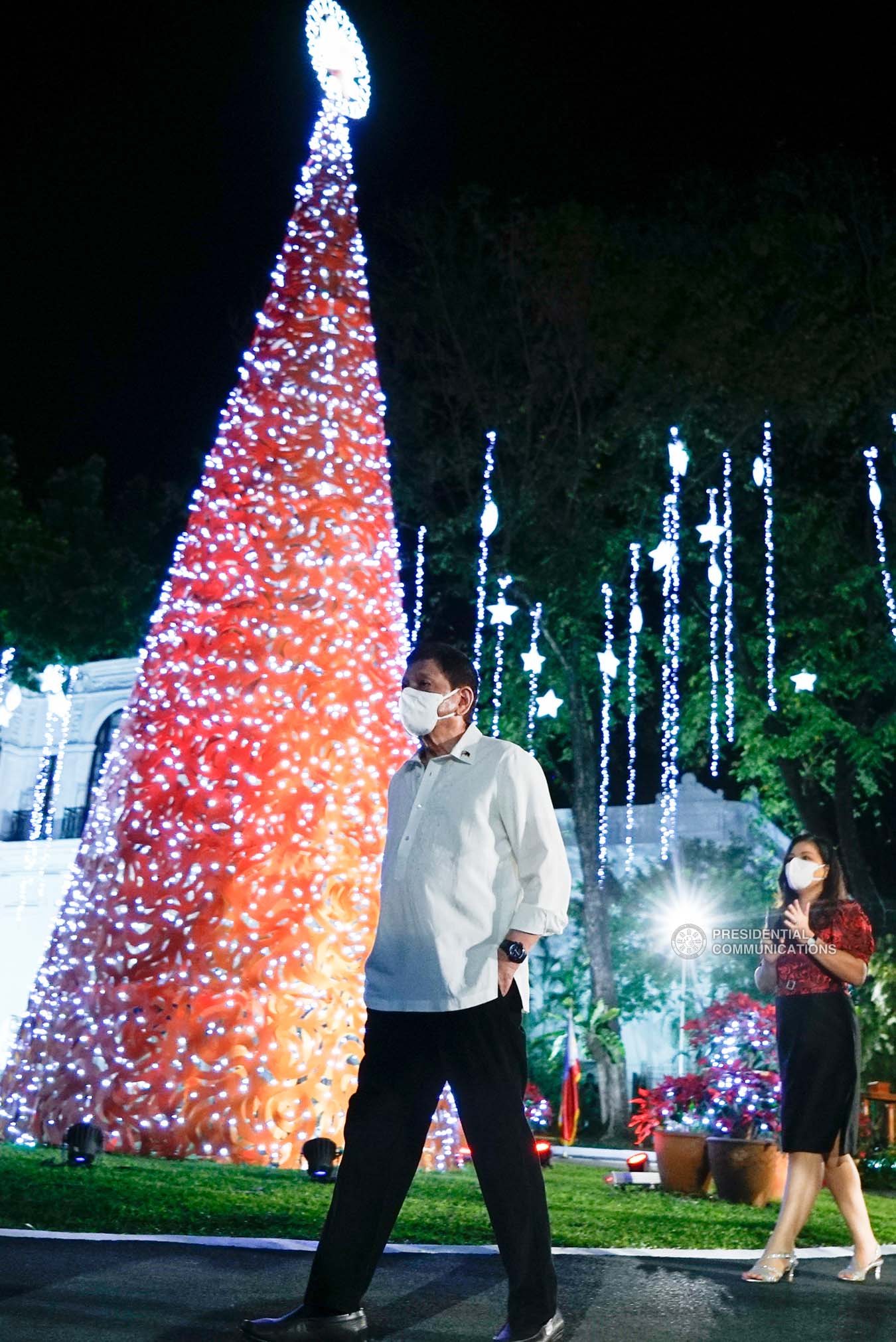 President Rodrigo Roa Duterte walks past the Christmas Tree of the Office of the President during the Christmas tree lighting ceremony at the Kalayaan Grounds in Malacañan Palace on December 1, 2021. KING RODRIGUEZ/ PRESIDENTIAL PHOTO