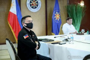 Senator Christopher Lawrence "Bong" Go listens as President Rodrigo Roa Duterte presides over a meeting with the Inter-Agency Task Force on the Emerging Infectious Diseases (IATF-EID) core members at the Malacañan Palace on January 6, 2022. ROBINSON NIÑAL/ PRESIDENTIAL PHOTO